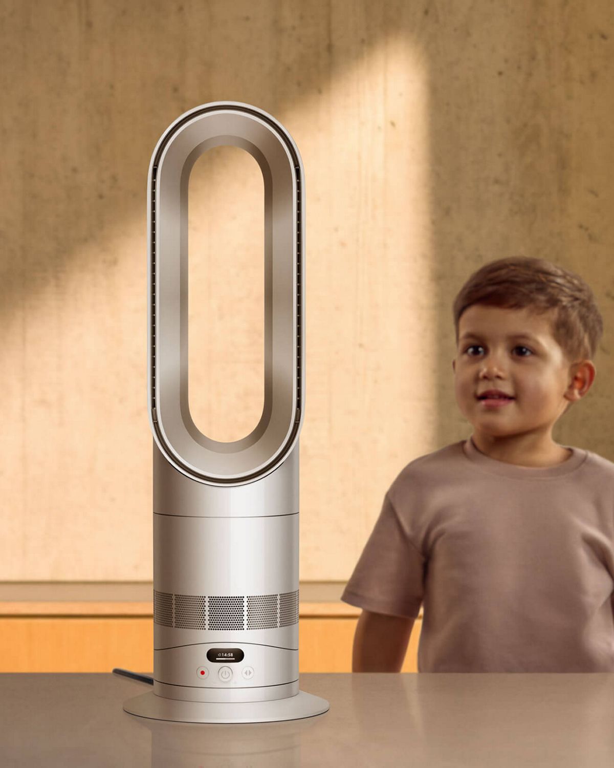 The Dyson Hot+Cool HF1 Remote Link Pre-heat heater and cooling fan next to a small child.