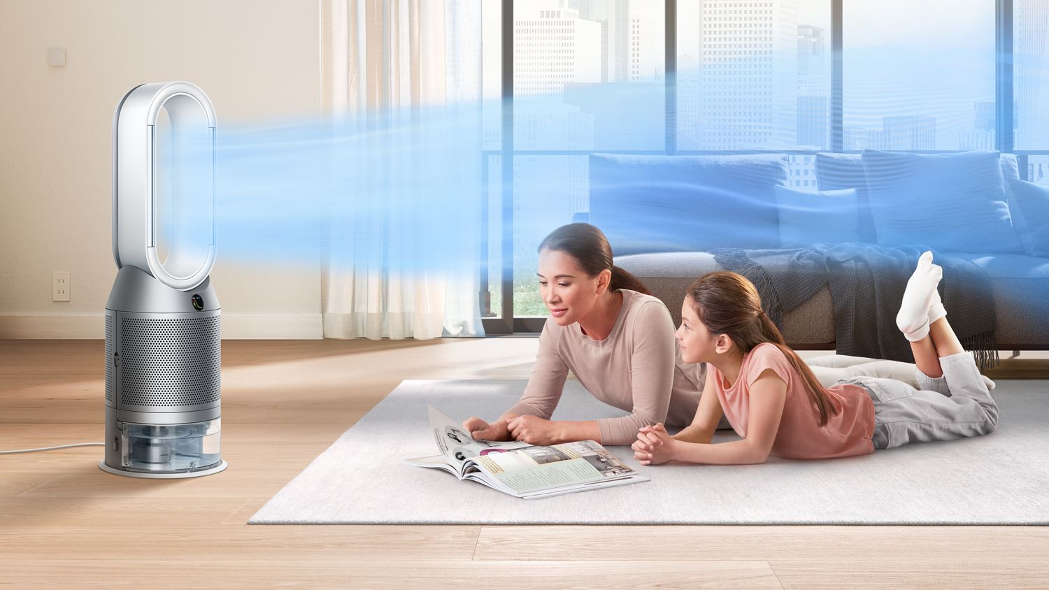 Dyson purifier humidy+cool autoreact PH3A humidifiying and purifying the air while a mother and daughter read