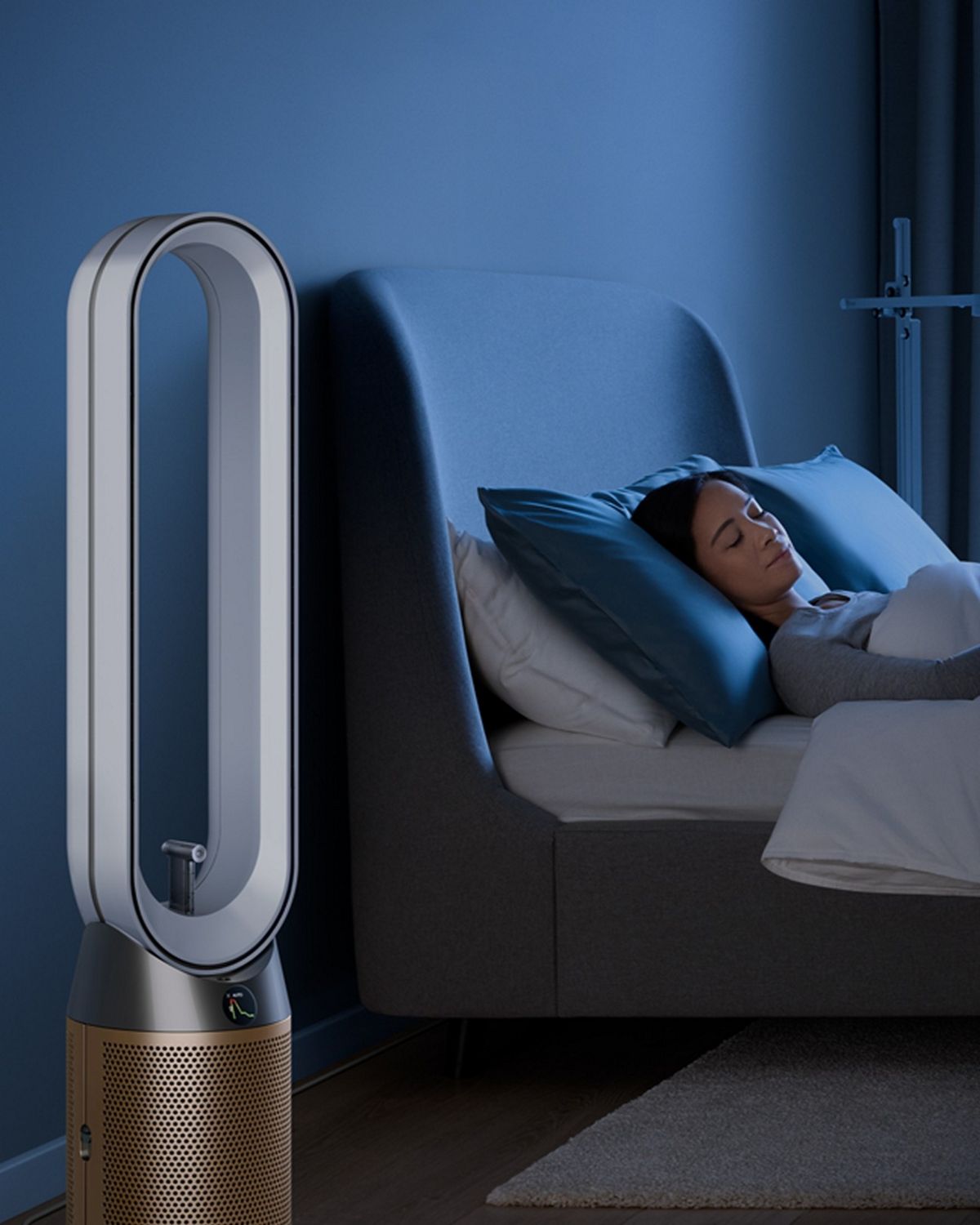 A person sleeps next to their Dyson Find+Follow Purifier Cool fan.