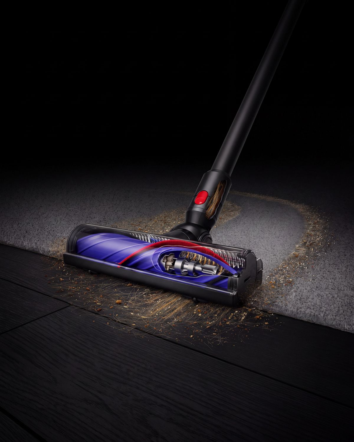 The Dyson Motorbar cleaner head cleans debris between carpet and a hard floor.