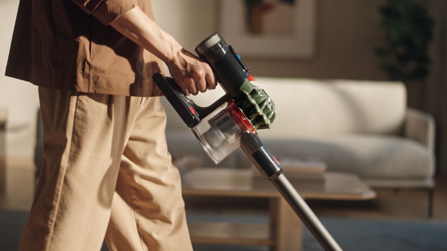 The Dyson V8 Cyclone cordless vacuum used to clean in a home.