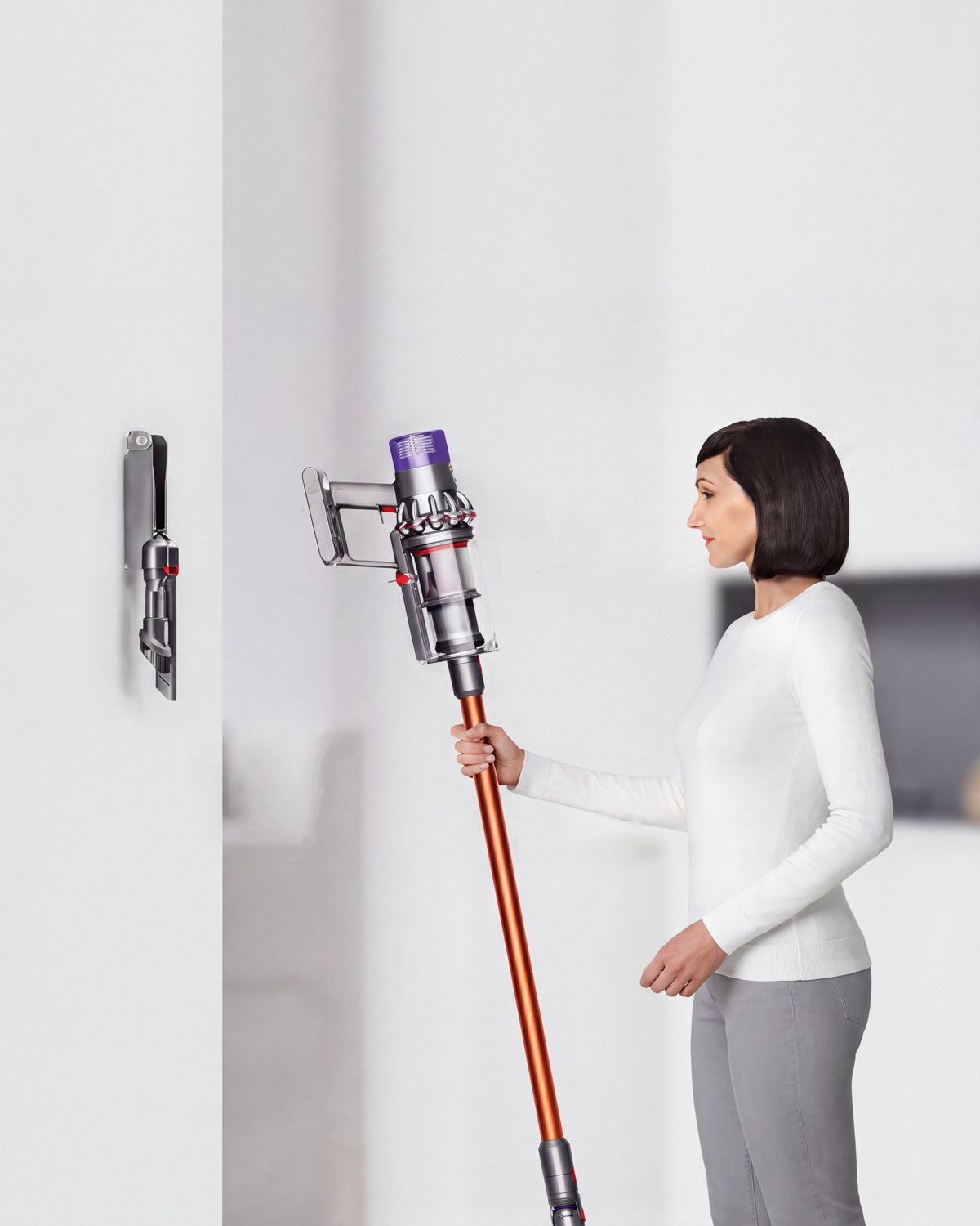 Dyson Cyclone V10 vacuum placed onto the wall-mounted dock.