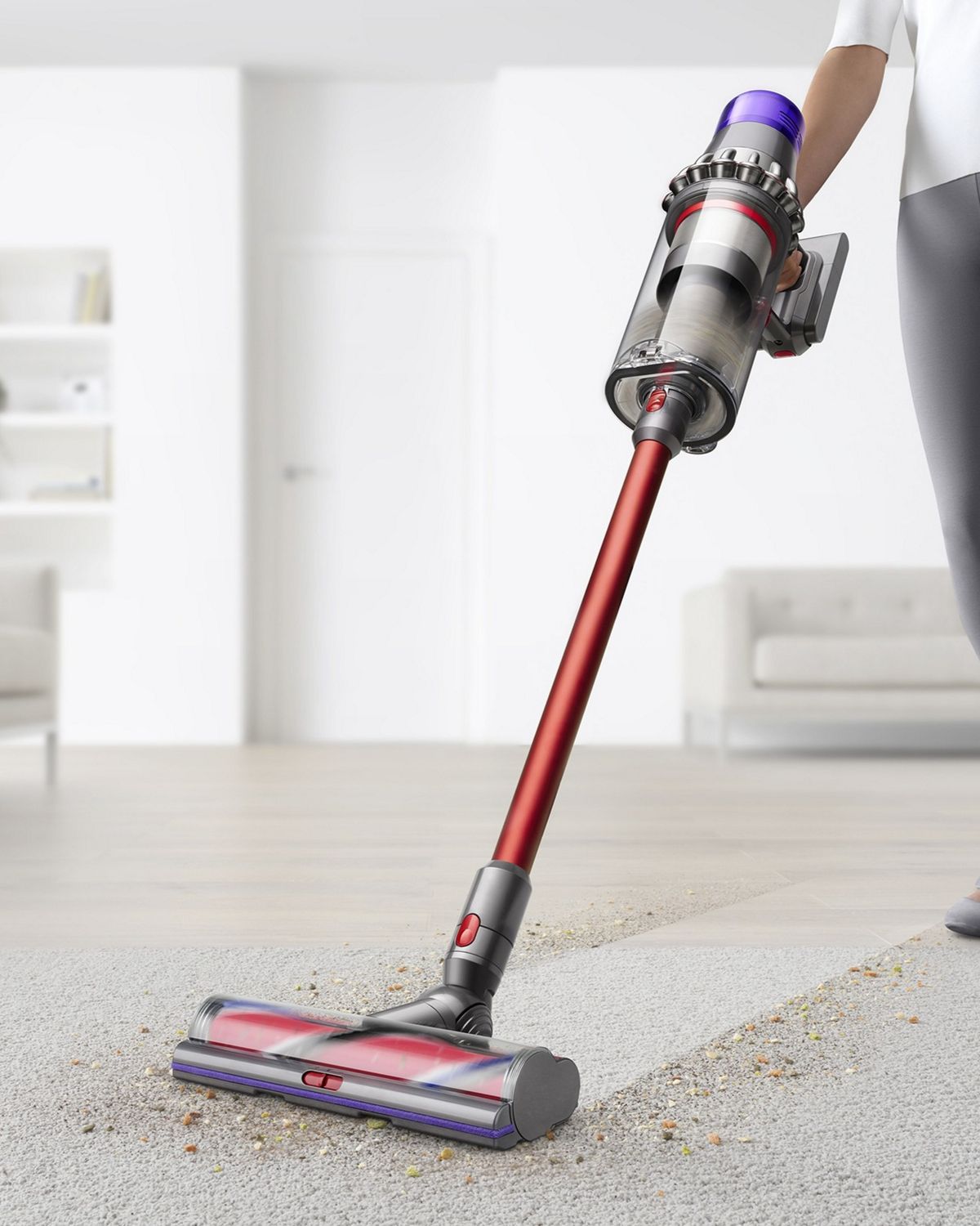 Dyson Outsize vacuum cleaner head moving from hard floor to carpet.