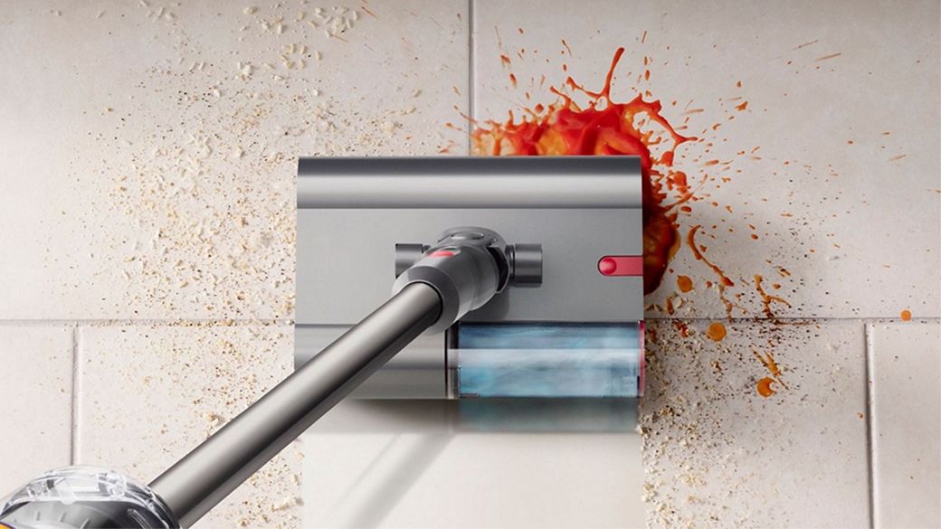 The Dyson Submarine cleaner head used to clean a spill from a hard floor.