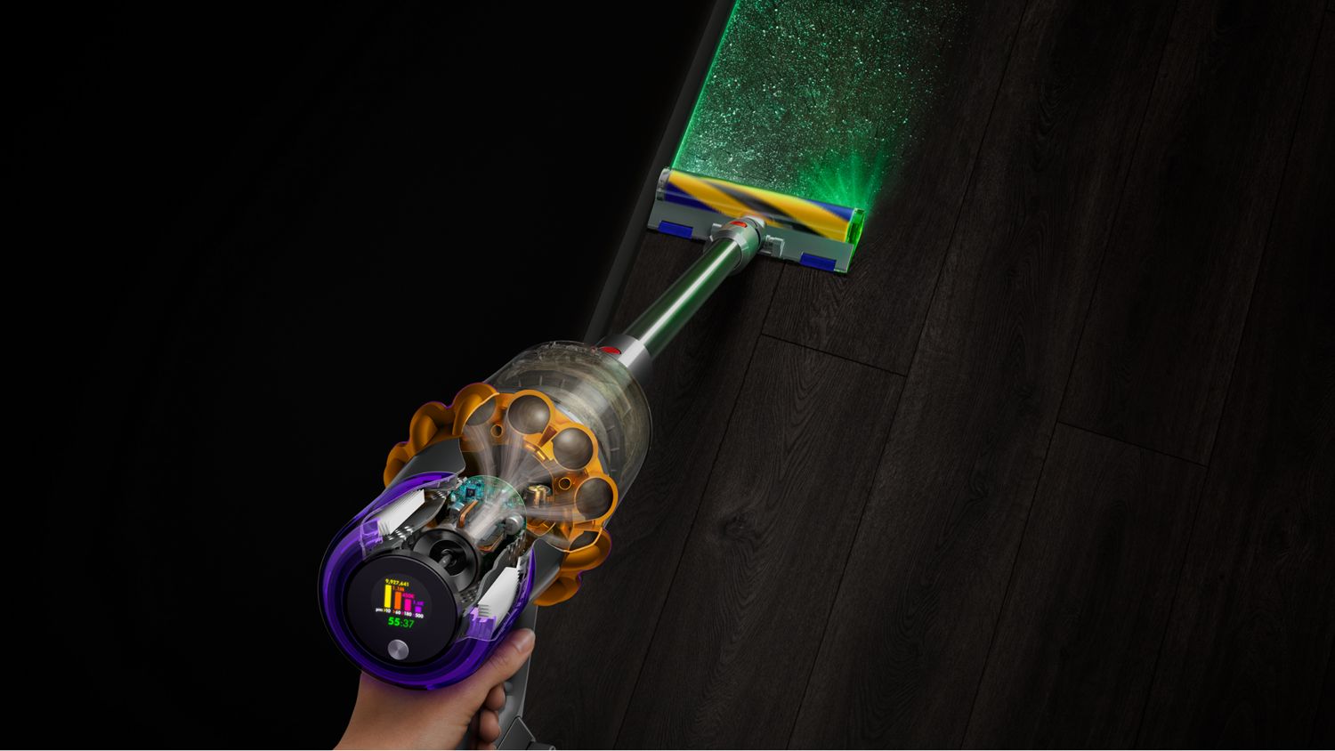 An aerial view of the Dyson V15 Detect vacuum picking up dust the illuminated by the Fluffy cleanerhead