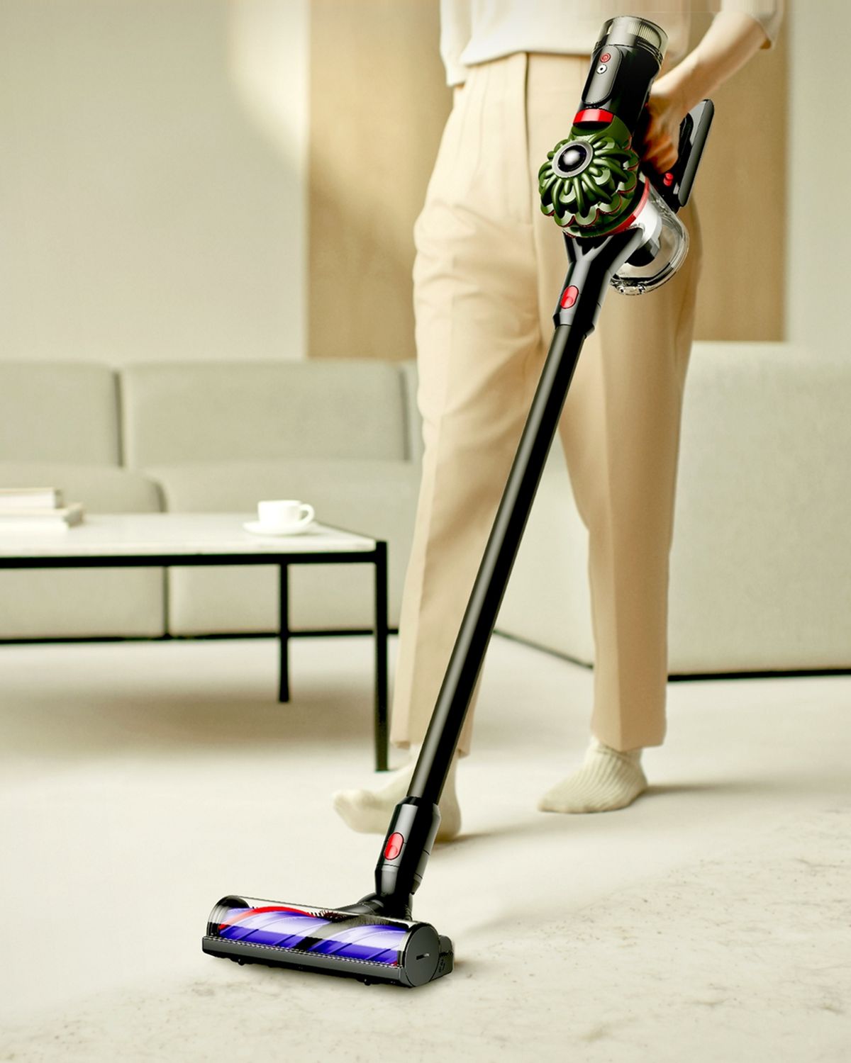 The Dyson V8 Cyclone vacuum used to clean floors in a living room.