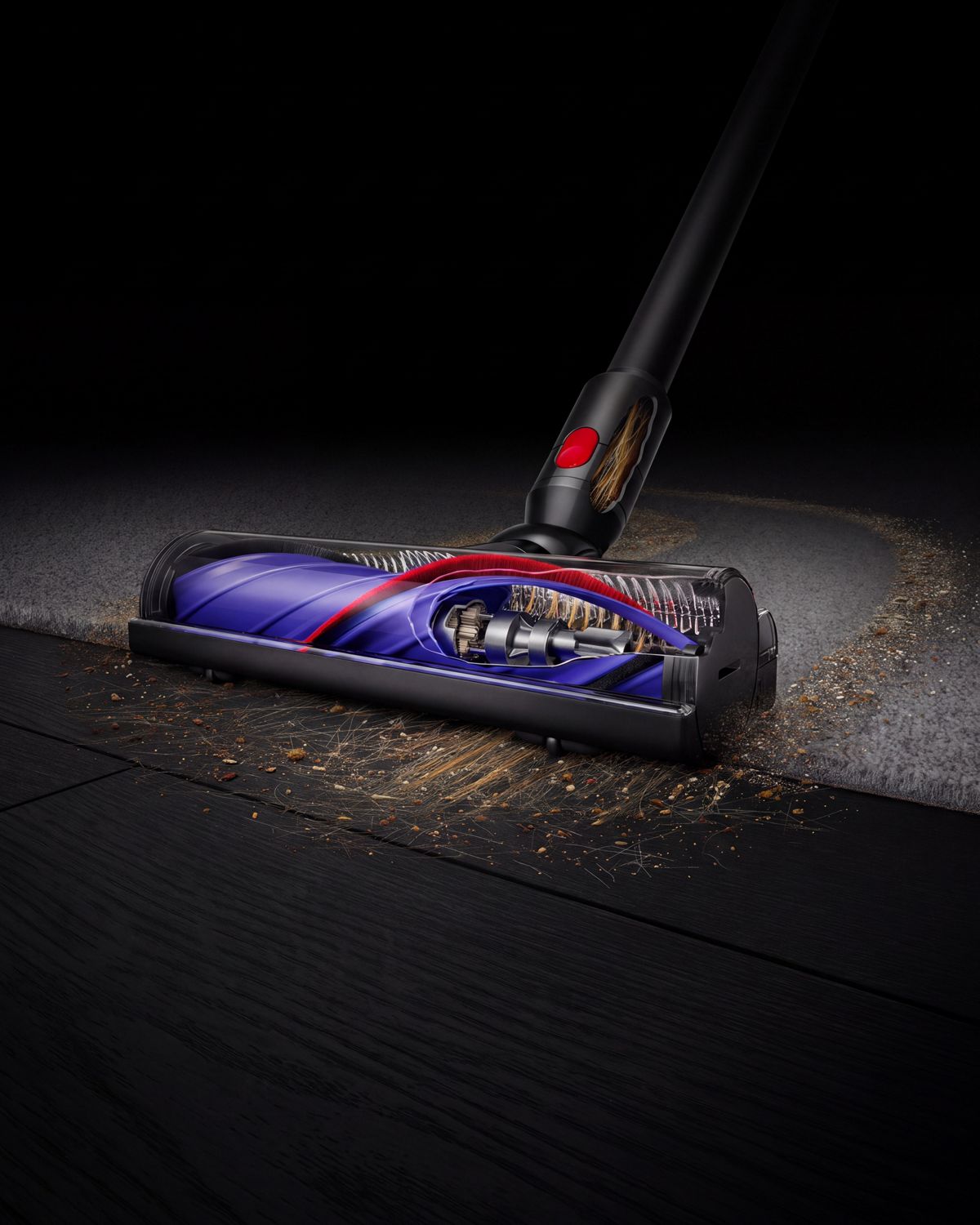 Dyson Motorbar cleaner head cleans debris between carpet and a hard floor.