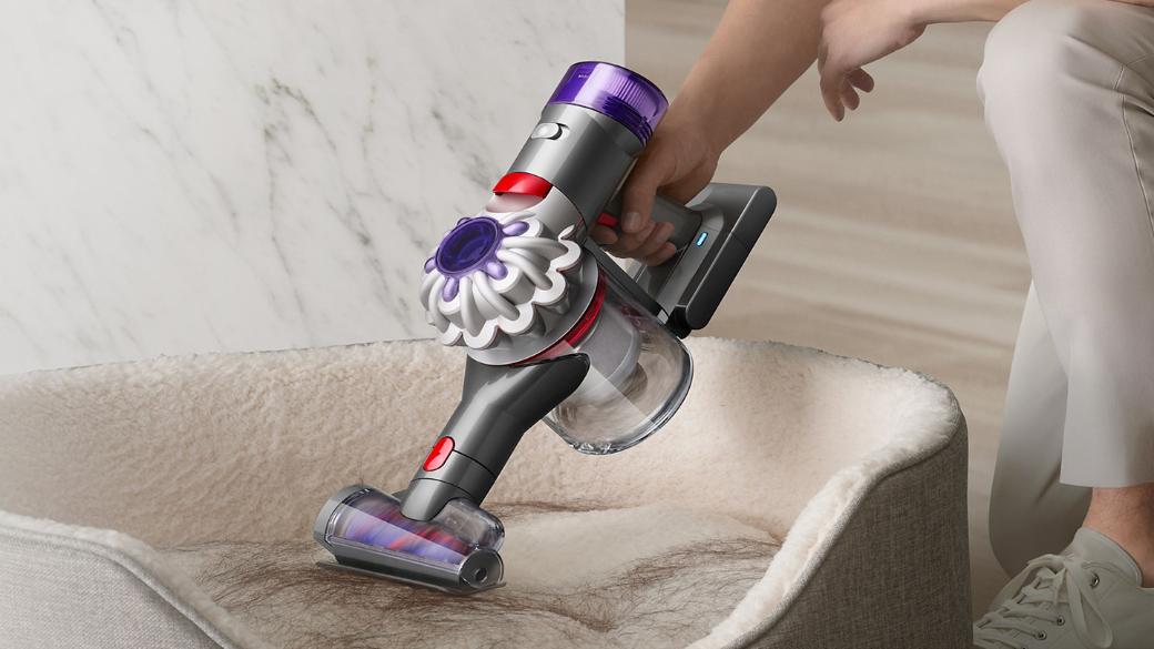 Dyson V8 Focus Clean handheld vacuum used to clean a pet bed.