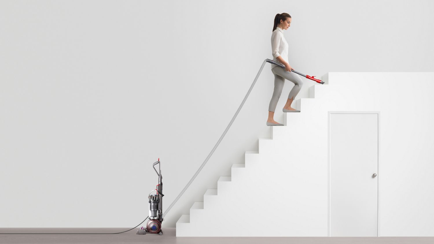 Dyson Ball Animal Origin vacuum cleaner used to clean stairs.