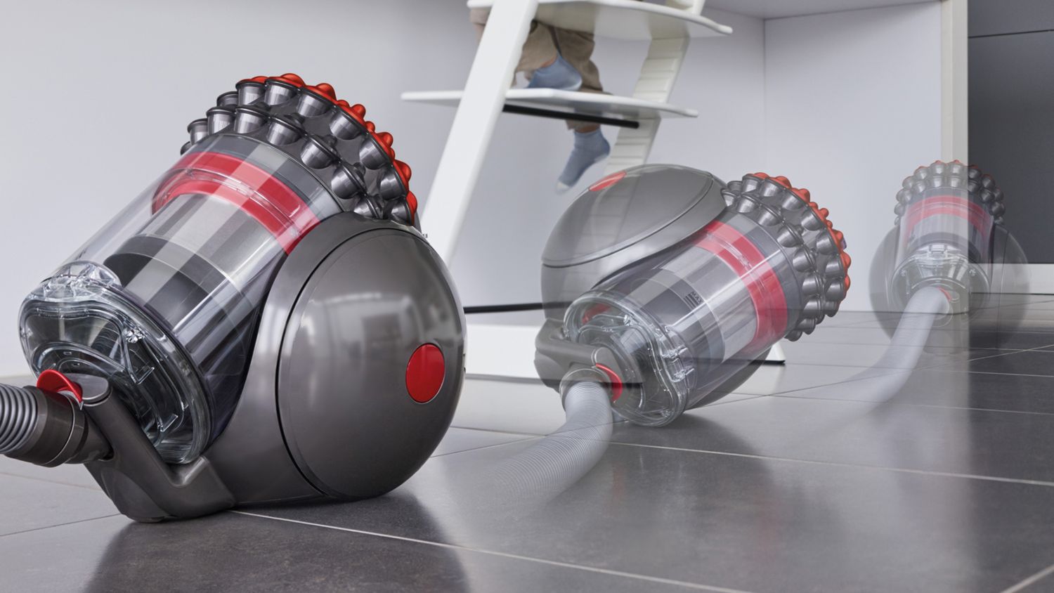 Dyson Big Ball vacuum showing self-righting technology near a counter in a kitchen setting.