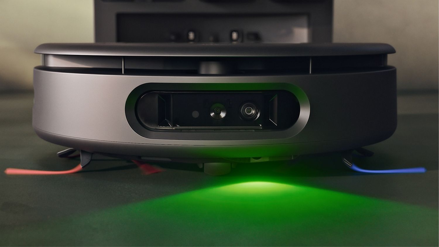 The Dyson Spot+Scrub Ai wet and dry robot vacuum emerges from its Cyclonic dock. 