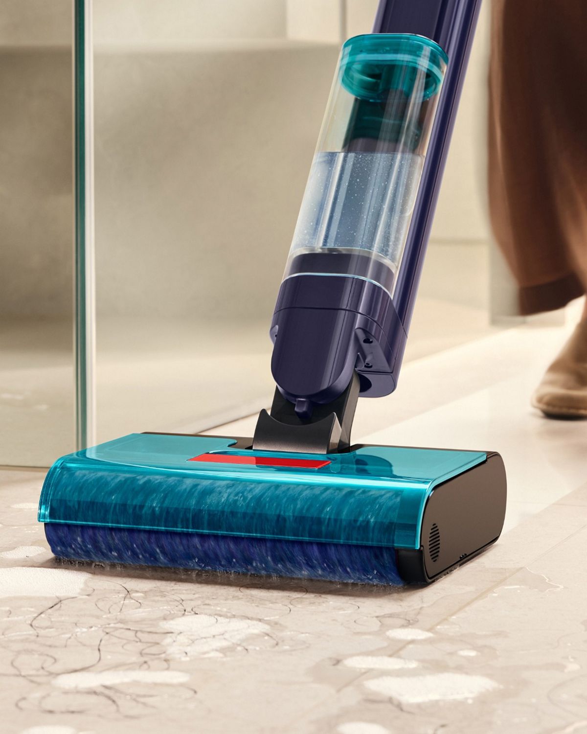 The Dyson Clean+Wash Hygiene hard floor cleaner cleaning wet spills from the floor.