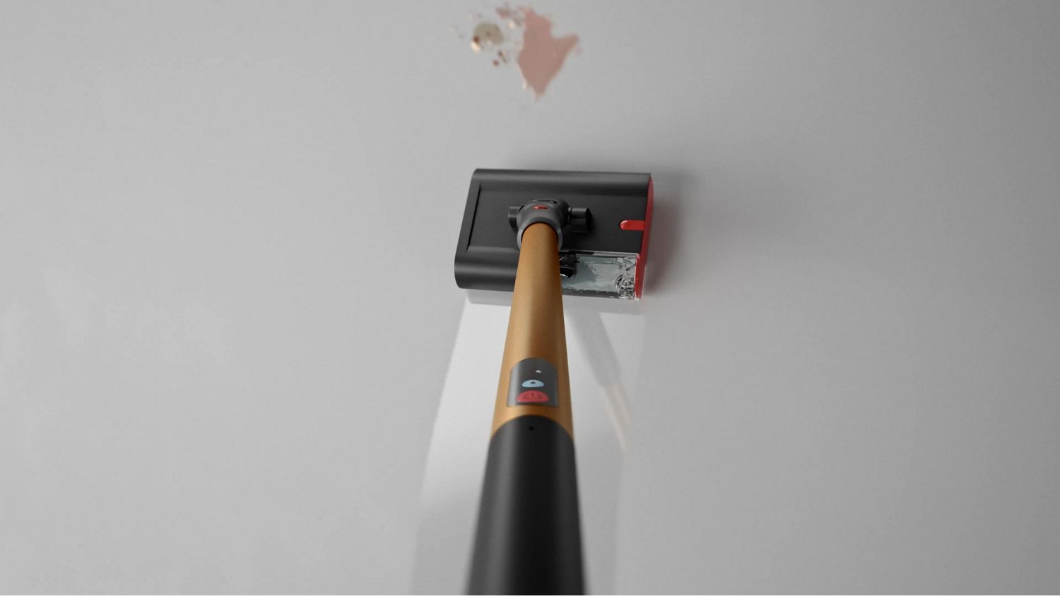 Le nettoyeur de sols Dyson PencilWash est utilisé pour nettoyer un liquide renversé sur un sol dur.