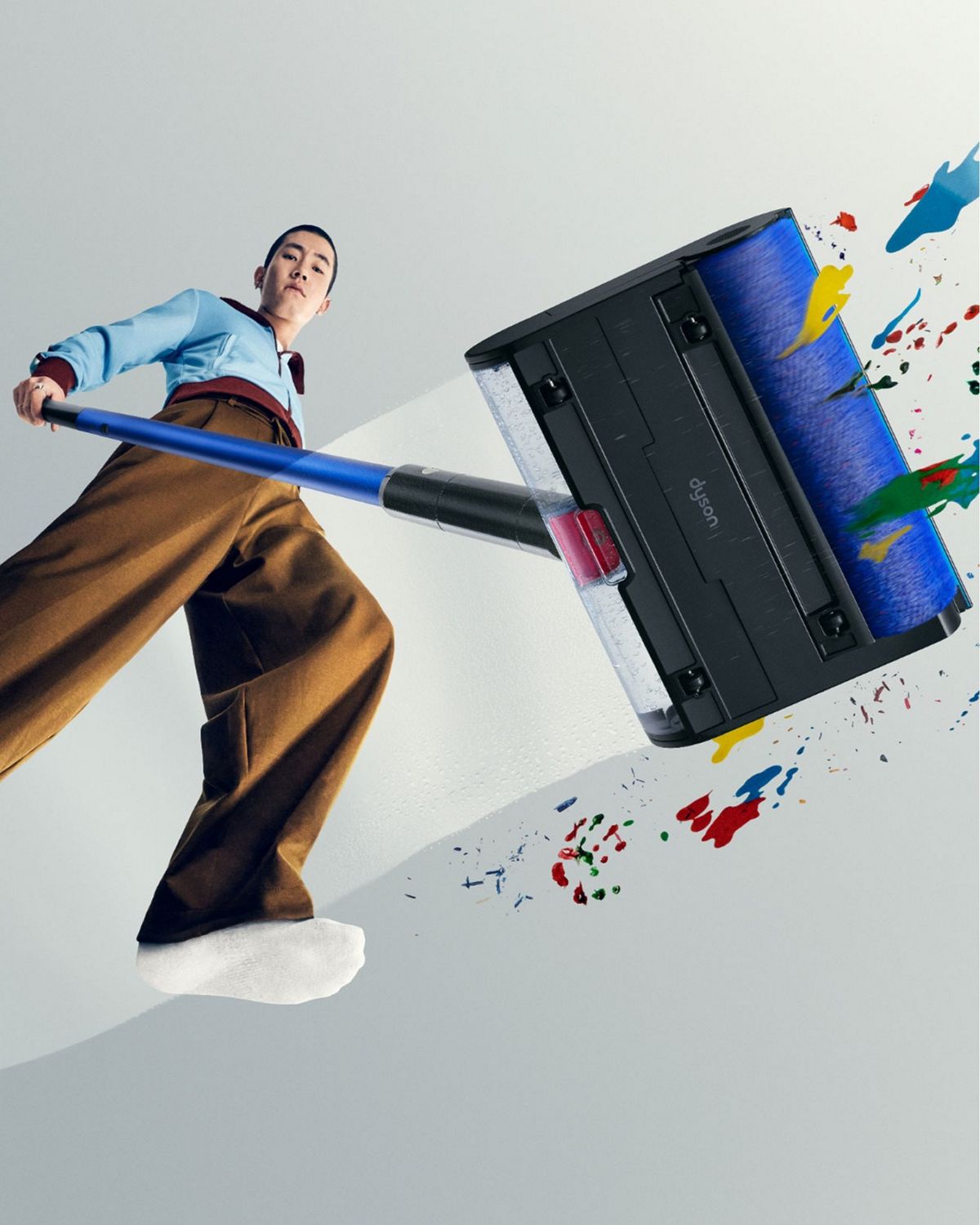 Dyson W1 PencilWash cleaner used to clean spills and stains from a hard floor.