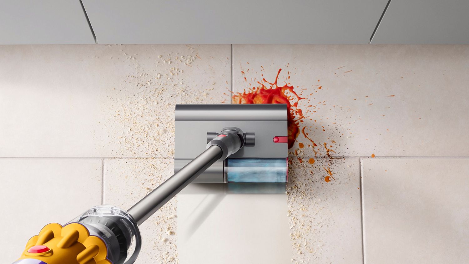 The Dyson V12s Detect Slim Submarine wet and dry vacuum cleaning a spill in the kitchen.