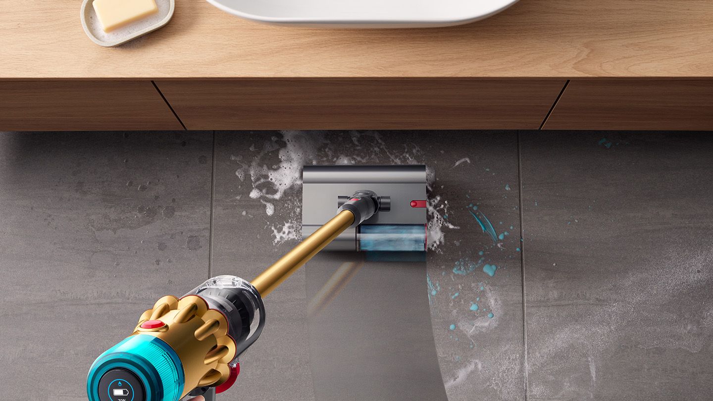 The Dyson V12s Detect Slim Submarine cleans the floor of a bathroom.