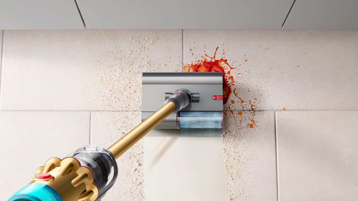 The Dyson V12s Detect Slim Submarine cleans the floor of a kitchen.