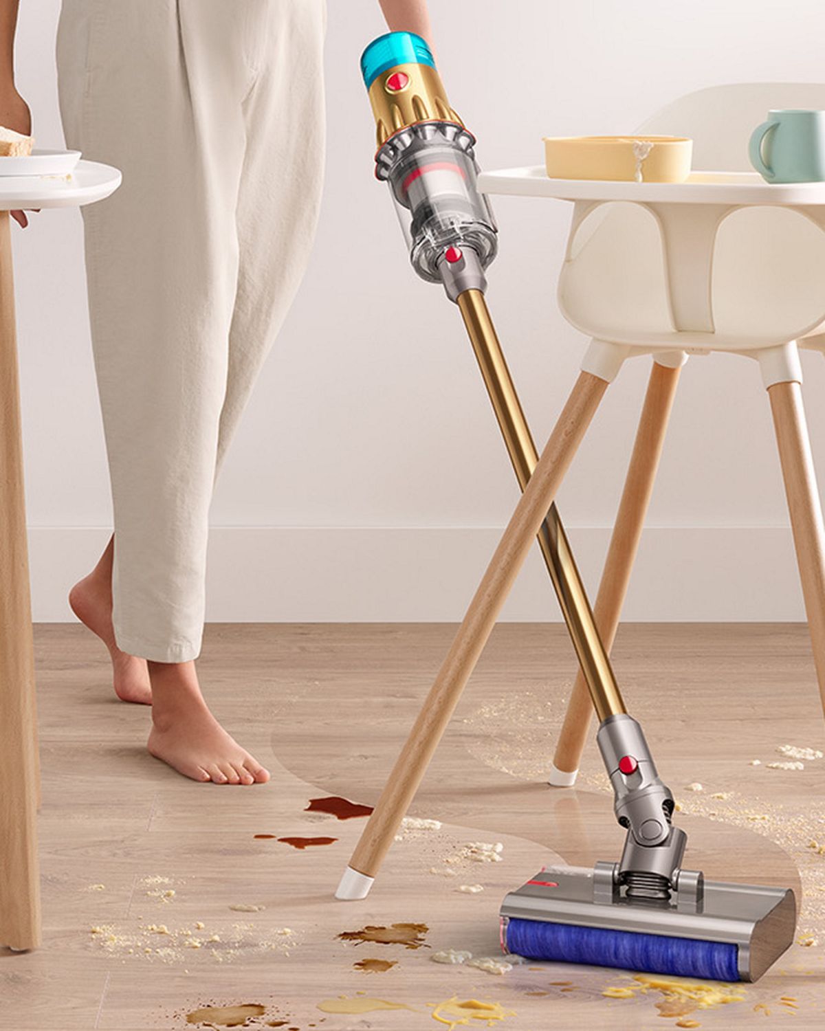 The Dyson V12s Detect Slim Submarine cleans around the legs of a high chair.