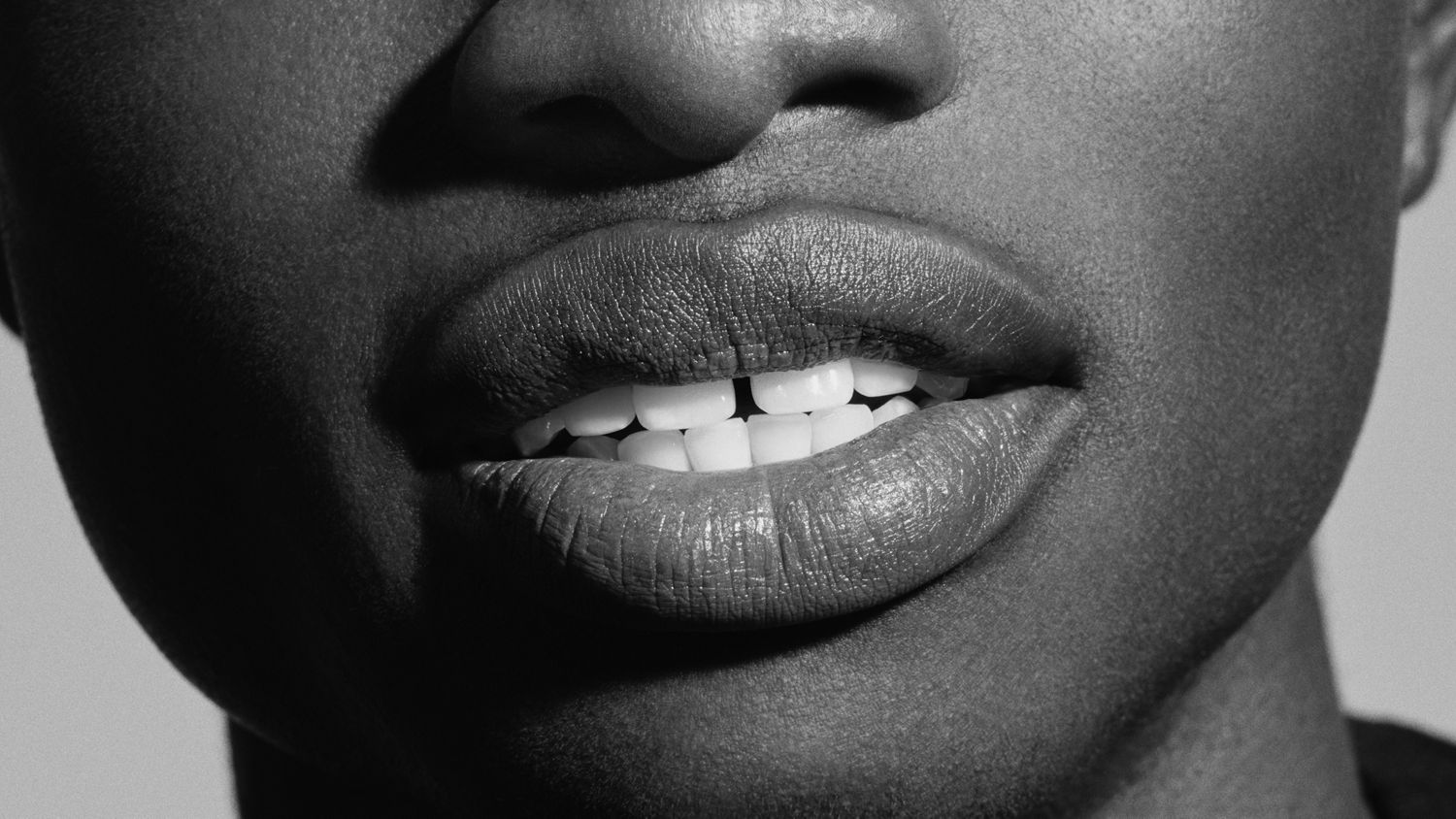 Close up of a smile showing healthy, white teeth.