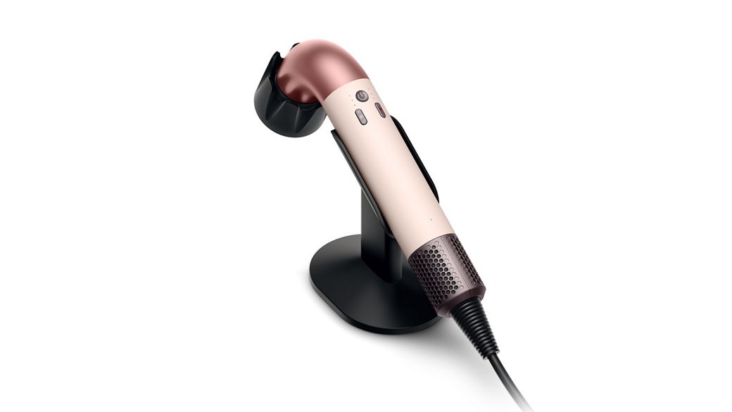 Dyson Supersonic r hair dryer on the Dyson-designed display stand for corded devices.