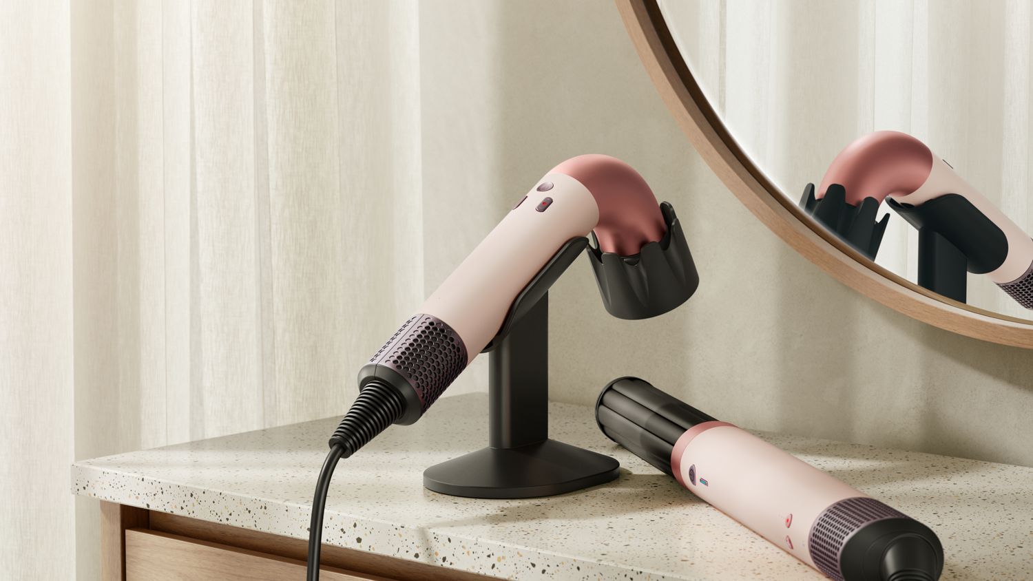Dyson Supersonic r hair dryer on the Dyson-designed display stand for corded devices.
