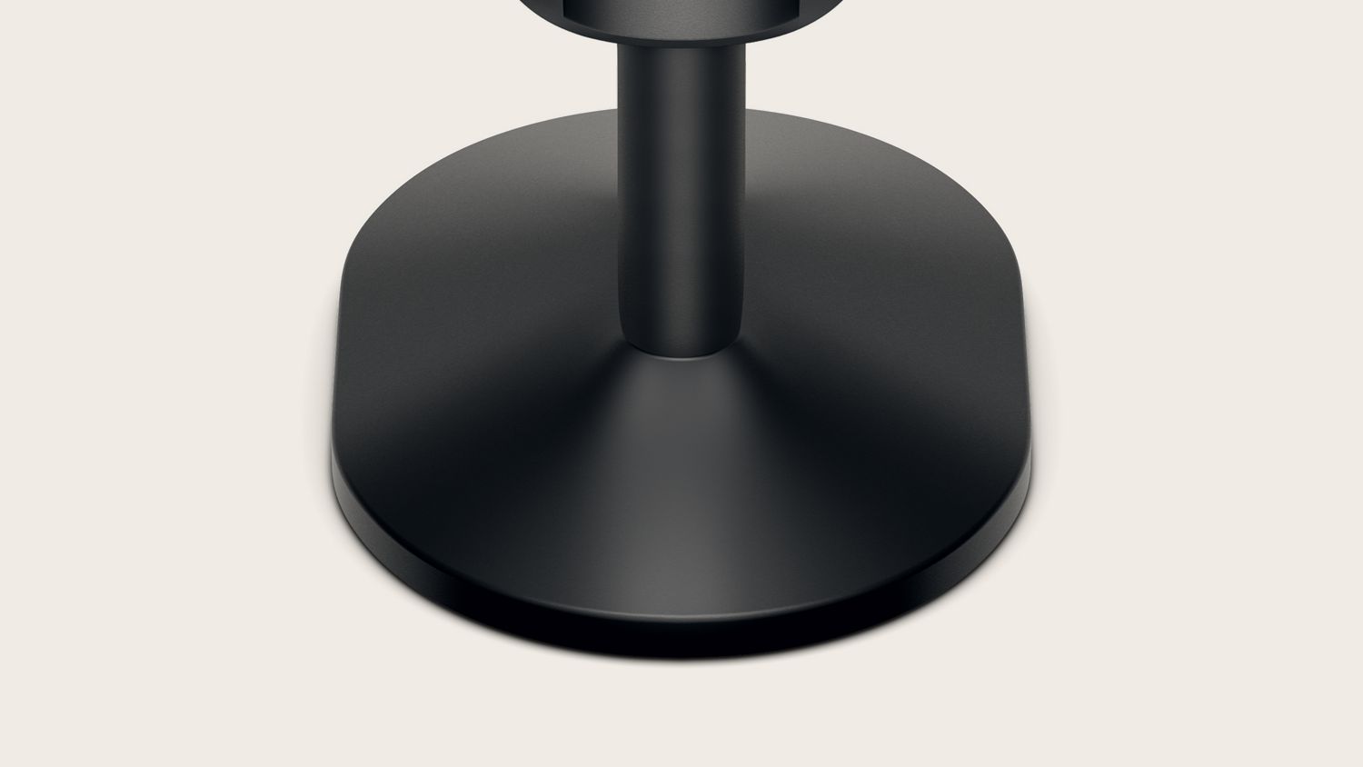 Close-up of the base of the Dyson-designed display stand for corded hair tools.