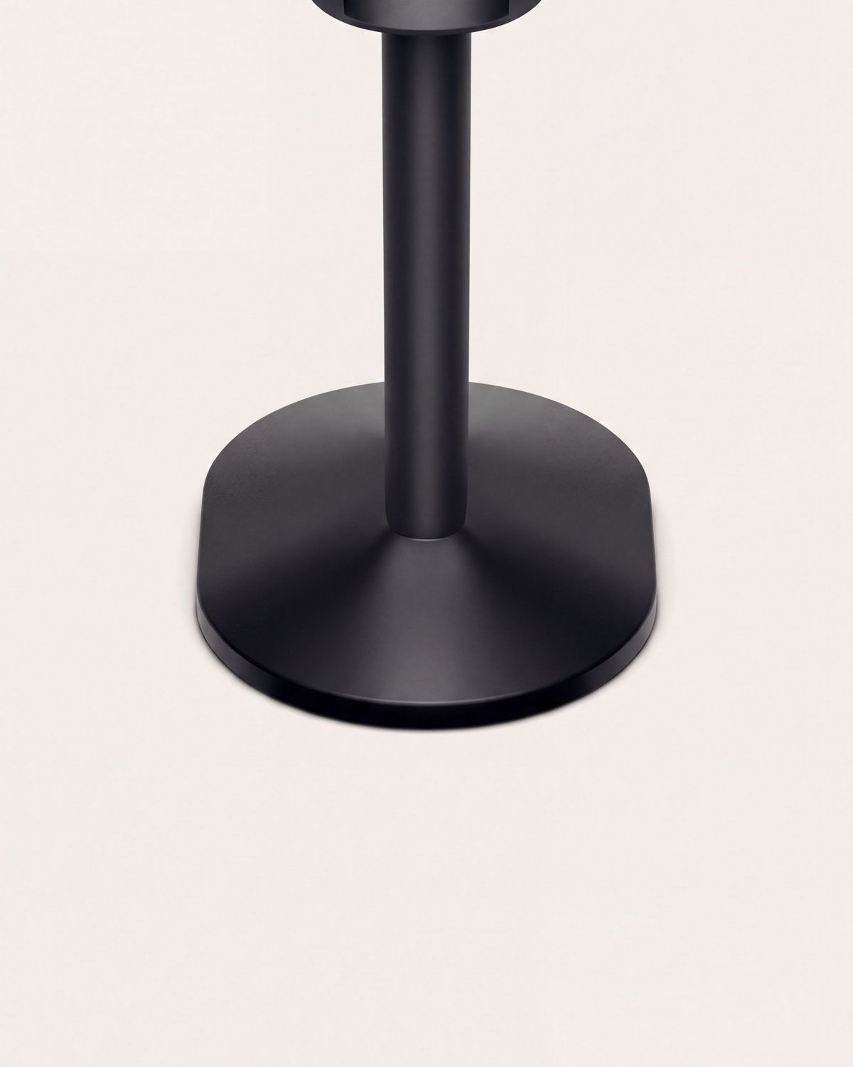 Close-up of the base of the Dyson-designed display stand for corded devices.