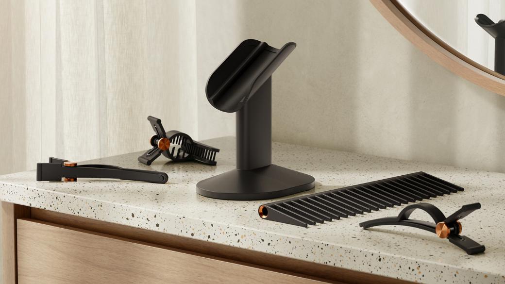 Dyson Supersonic r hair dryer on the Dyson-designed display stand for corded devices.