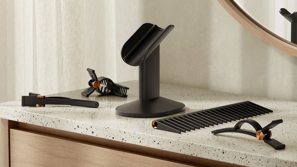 Dyson Supersonic r hair dryer on the Dyson-designed display stand for corded devices.