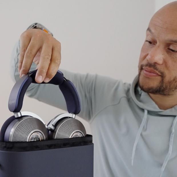 Man holding the case of the Dyson Zone noise-cancelling headphones