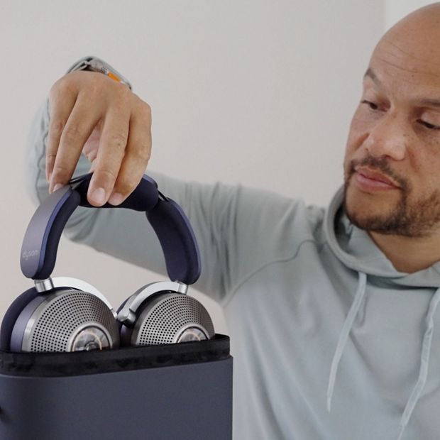 Man holding the case of the Dyson Zone noise-cancelling headphones