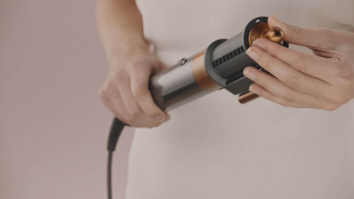 Model curls her hair with Dyson Airwrap multi-styler
