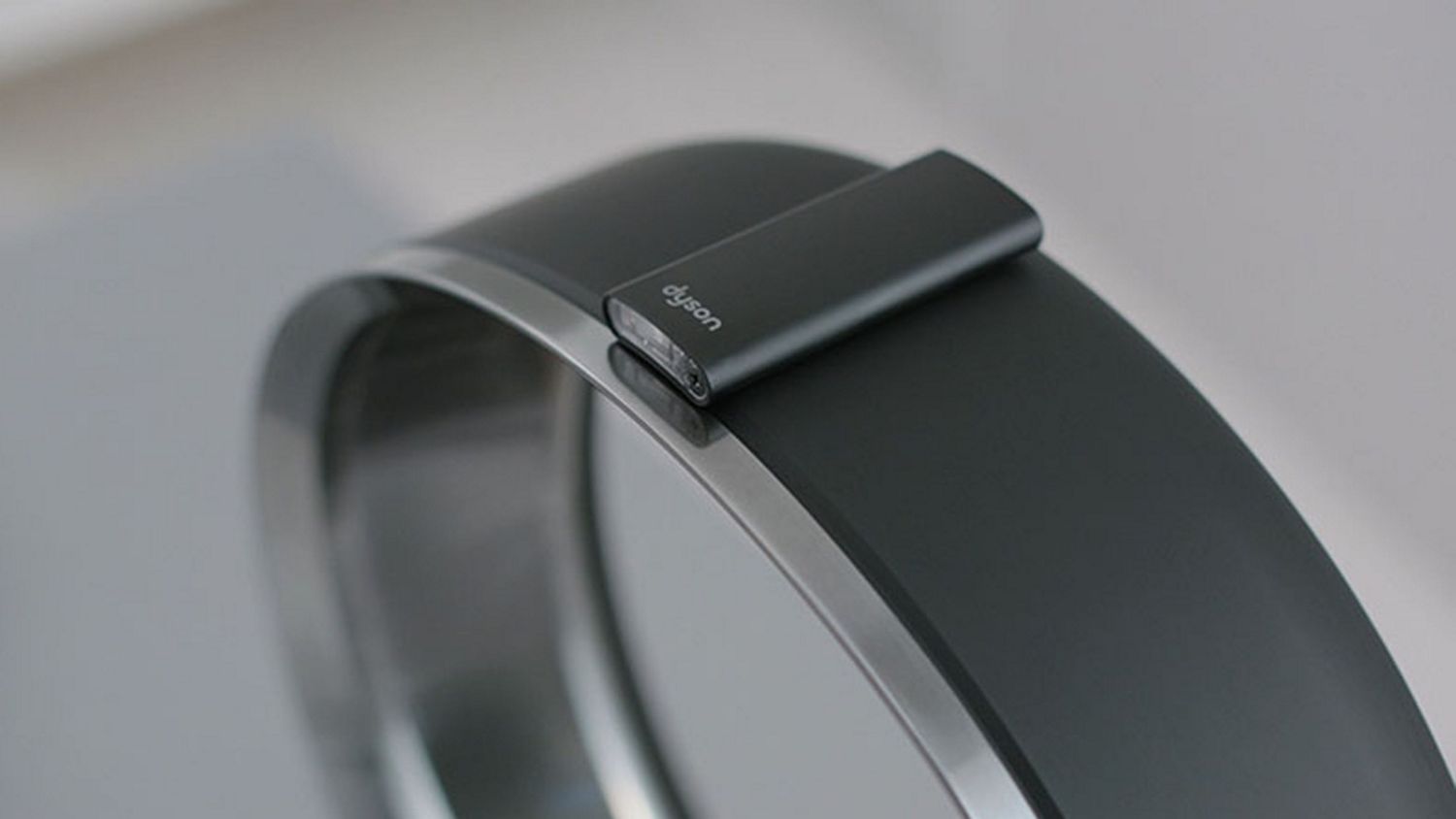 Dyson cool desk fan with remote attached to top.