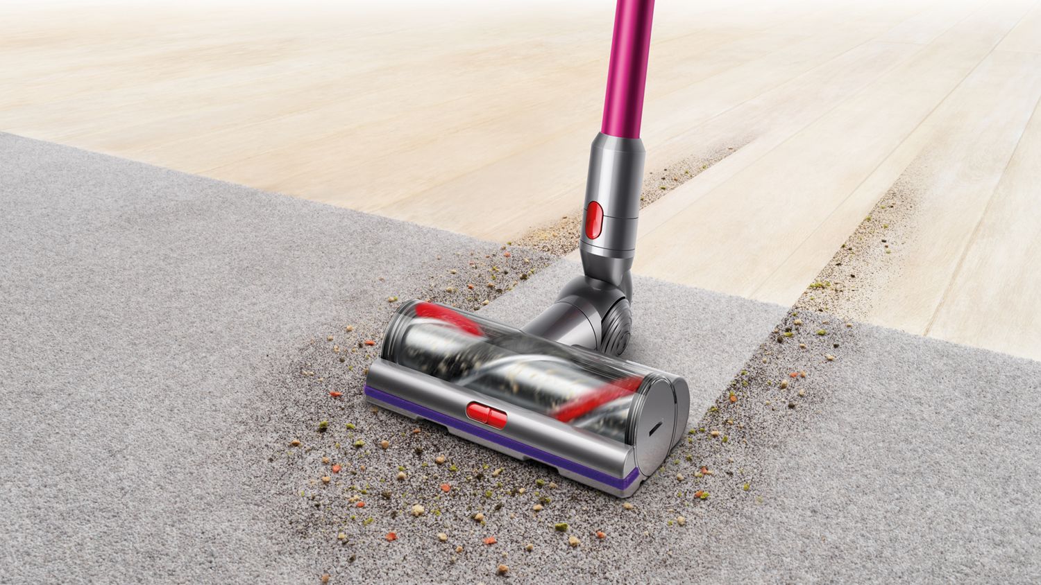 Tête d’aspirateur V11 à couple élevé ramassant des débris sur du tapis.