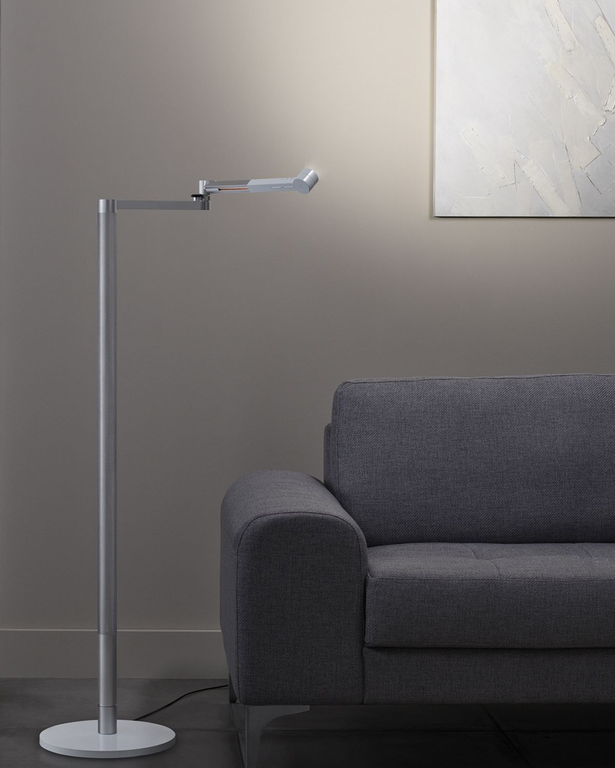Woman stands as Dyson lightcycle morph lights art work 