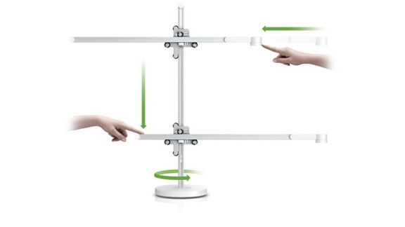 Un diagramma che illustra come il movimento a 3 Axis Glide permette alla luce di ruotare alla sua base, di essere posizionata più in alto o più in basso, più in avanti o indietro.