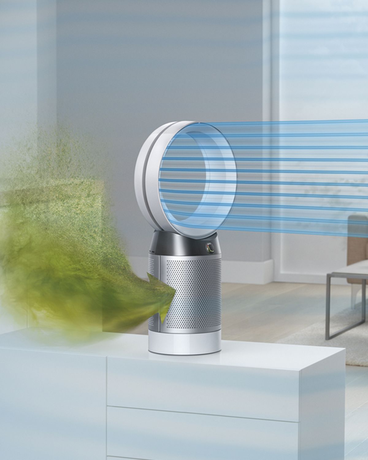 Polluted air is drawn into the Dyson Cool purifier fan and a stream of cool air is projected into the room. In the background sits a man reading to a small child. 