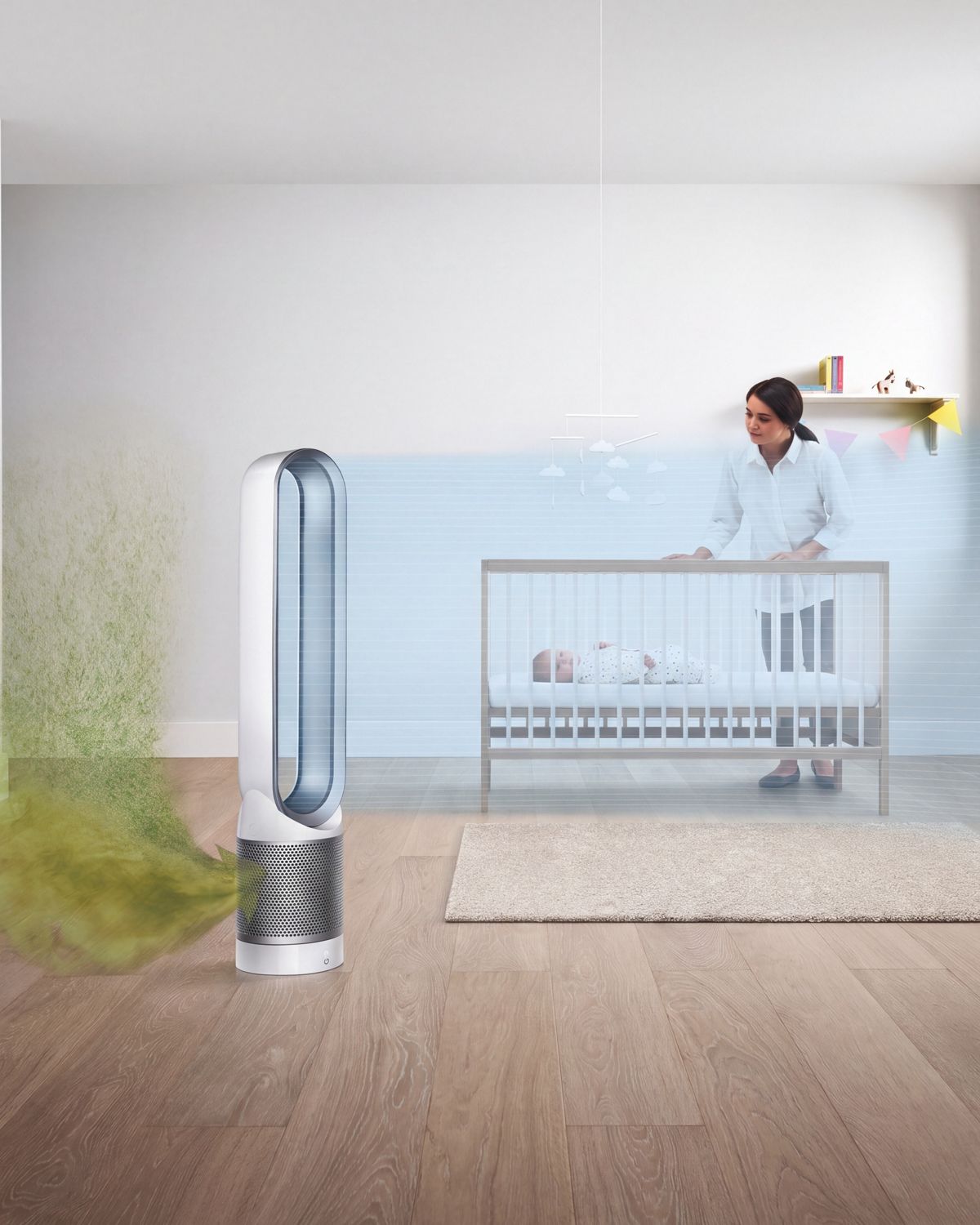 A woman puts a baby in its crib in the background while in the foreground, a Dyson Pure Cool  purifier fan is shown projecting purified air into the room. 