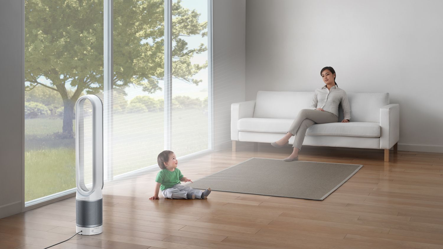 A woman and a child in a living room with a Dyson Pure Cool purifier fan. 