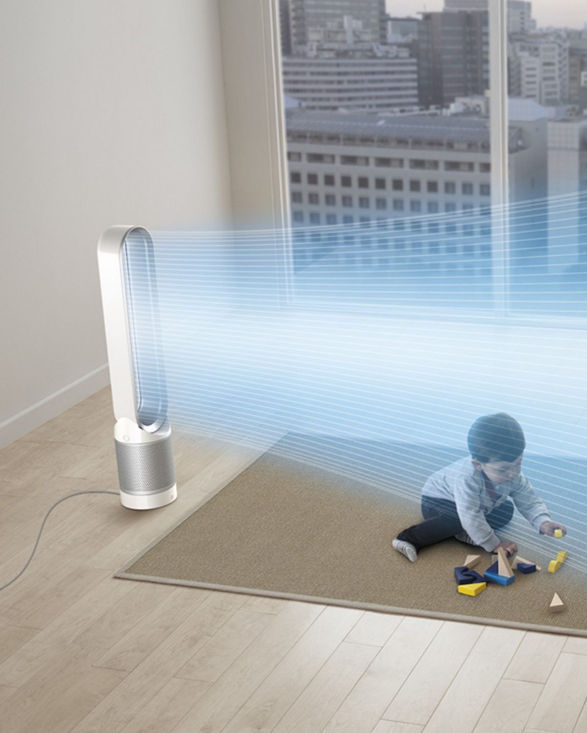 The Dyson Pure Cool purifier fan in the center of a family living room, while a child plays.The blue streams emanating from its loop show the projection of purified air around the room. 