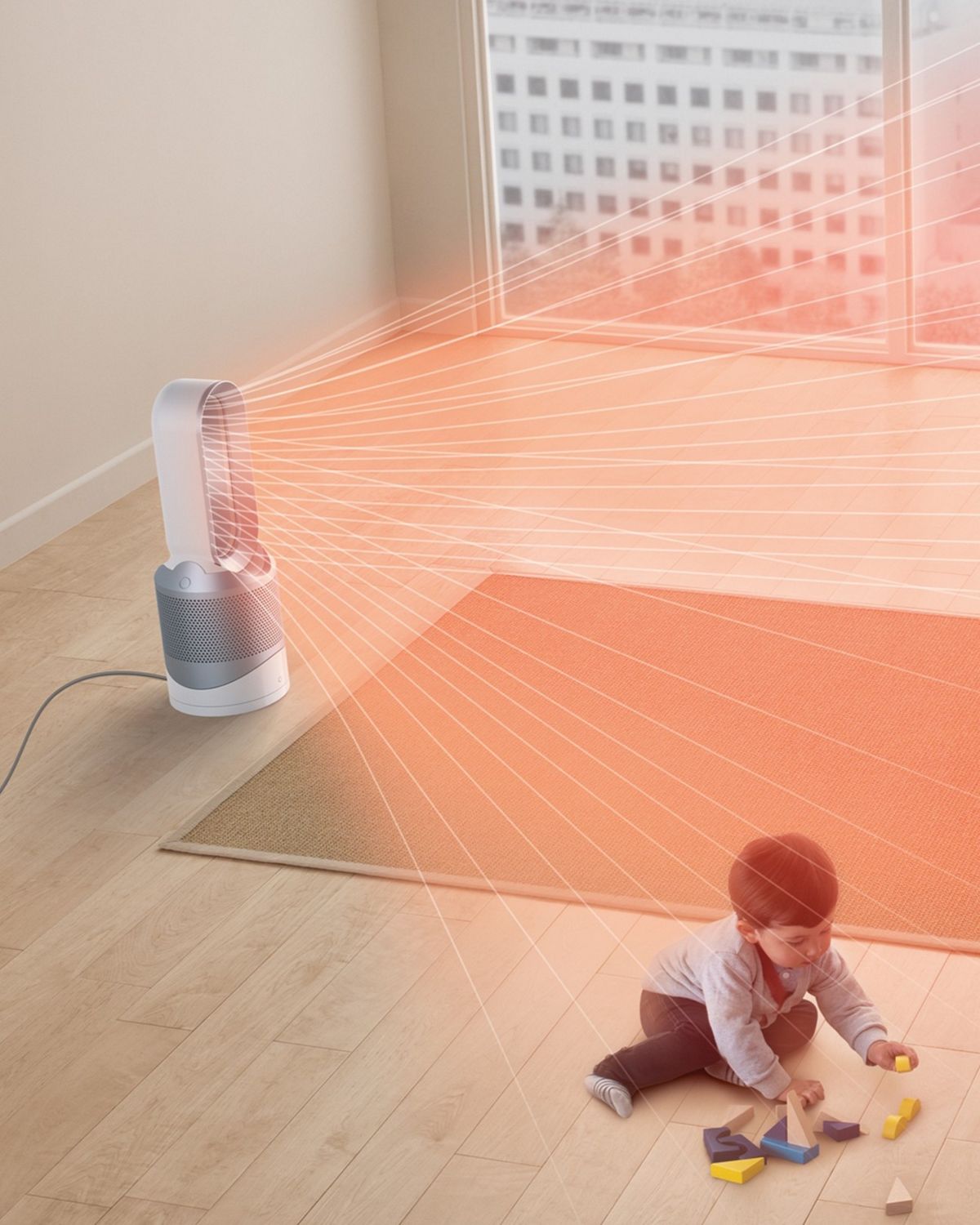 The Dyson Pure Cool purifier fan in the centre of a family living room, while a child plays.The red streams emanating from its loop show the projection of warm, purified air around the room.