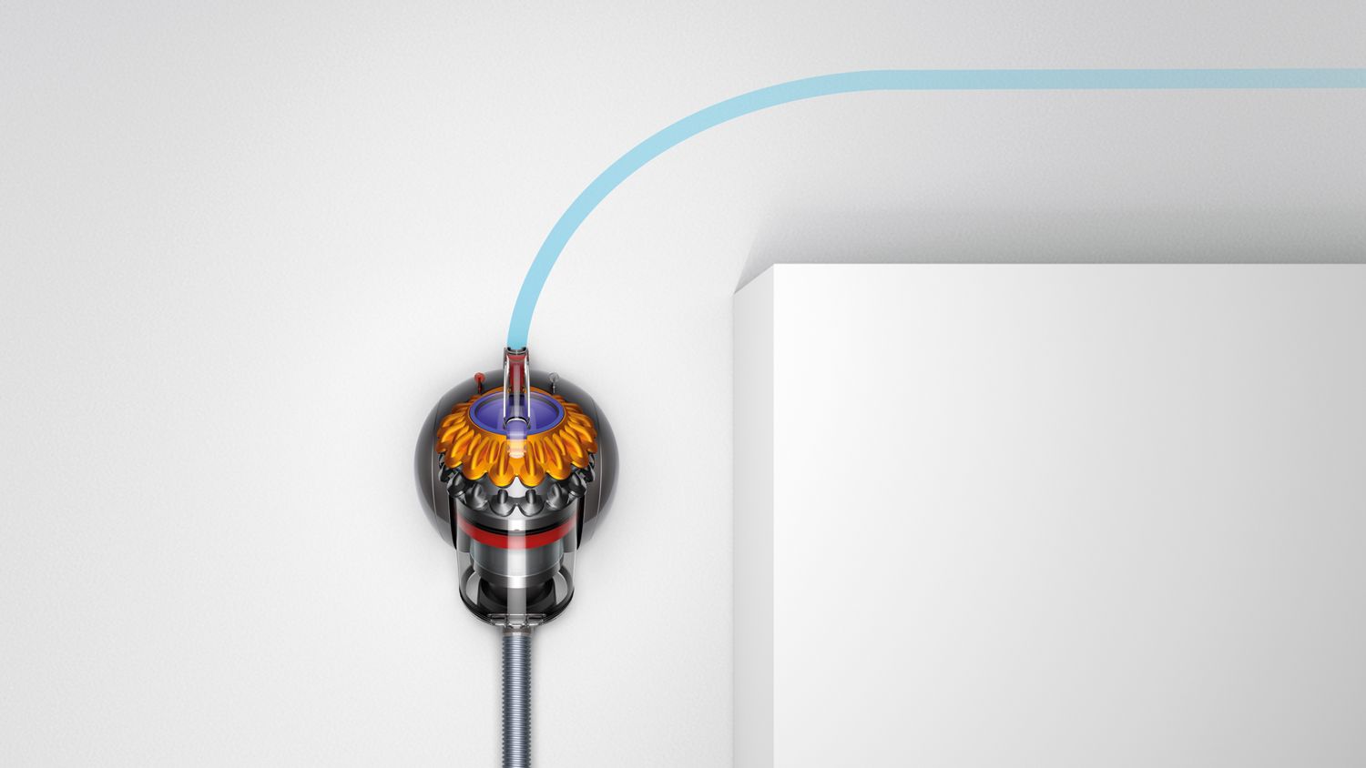 Image showing the Dyson Big ball canister vacuum cleaner easily manoeuvring around a corner.  