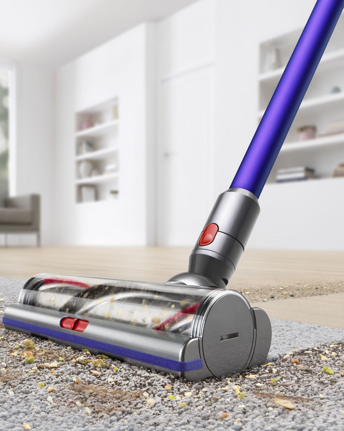 A Dyson V11 Animal cordless vacuum cleaner removing debris from hard floor and carpet