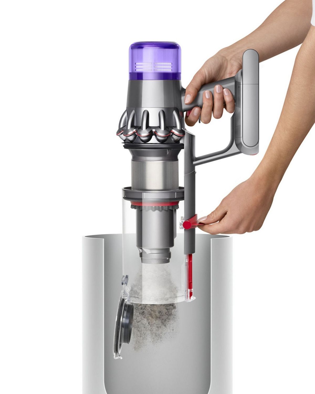 A Dyson V11 Animal cordless vacuum cleaner bin being emptied into a trash can