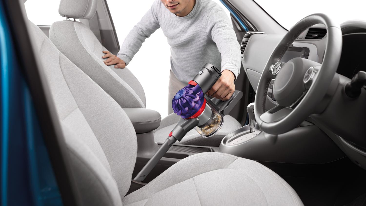 Crevice tool helping to clean the seats