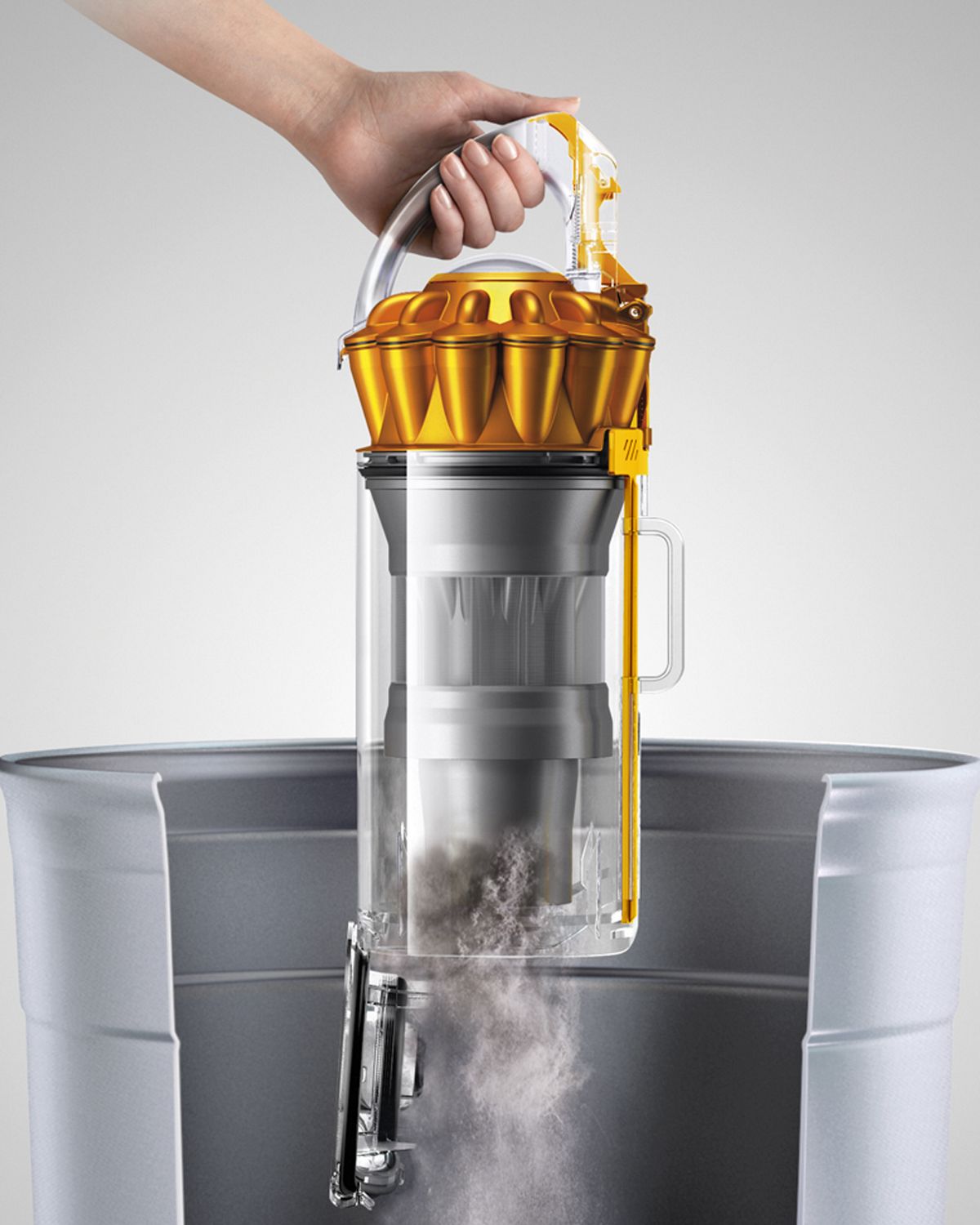 Dyson Ball Multifloor 2 upright vacuum cleaner cleaning carpet and hard floor side by side each other. 