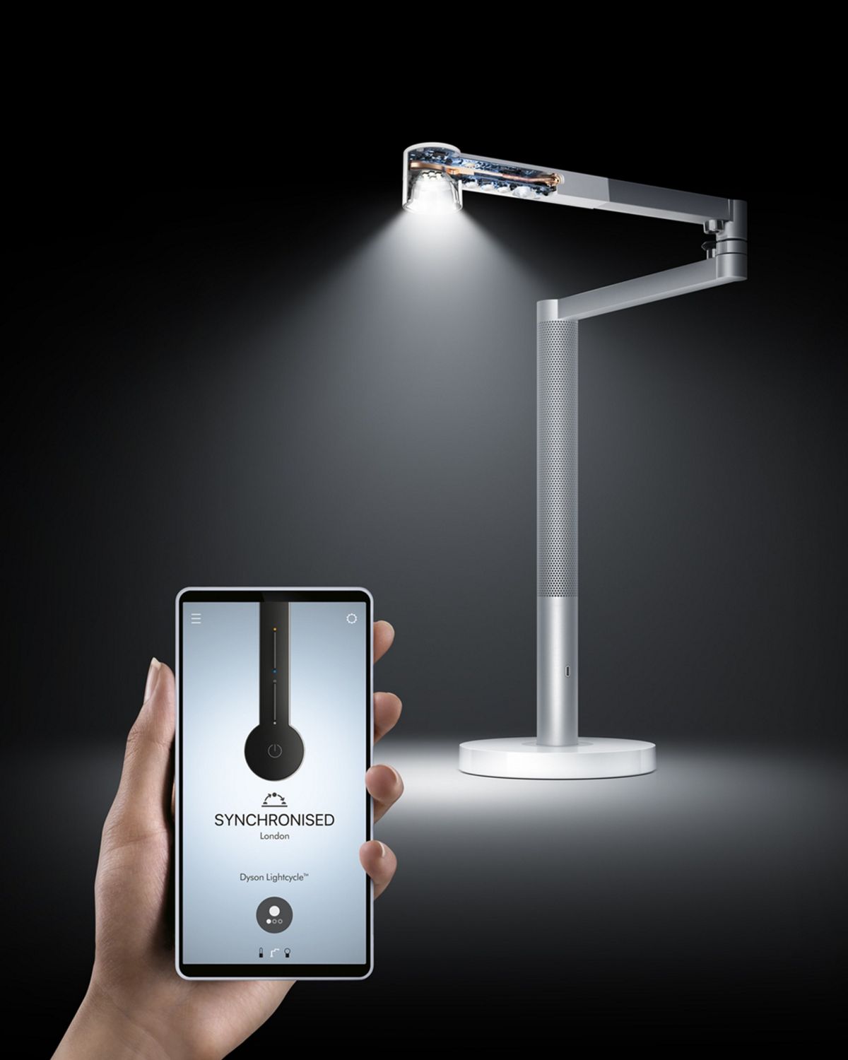 The Dyson Link app, with the Dyson Lightcyle Morph light in the background, next to a picture of the globe showing the time and date lines. 