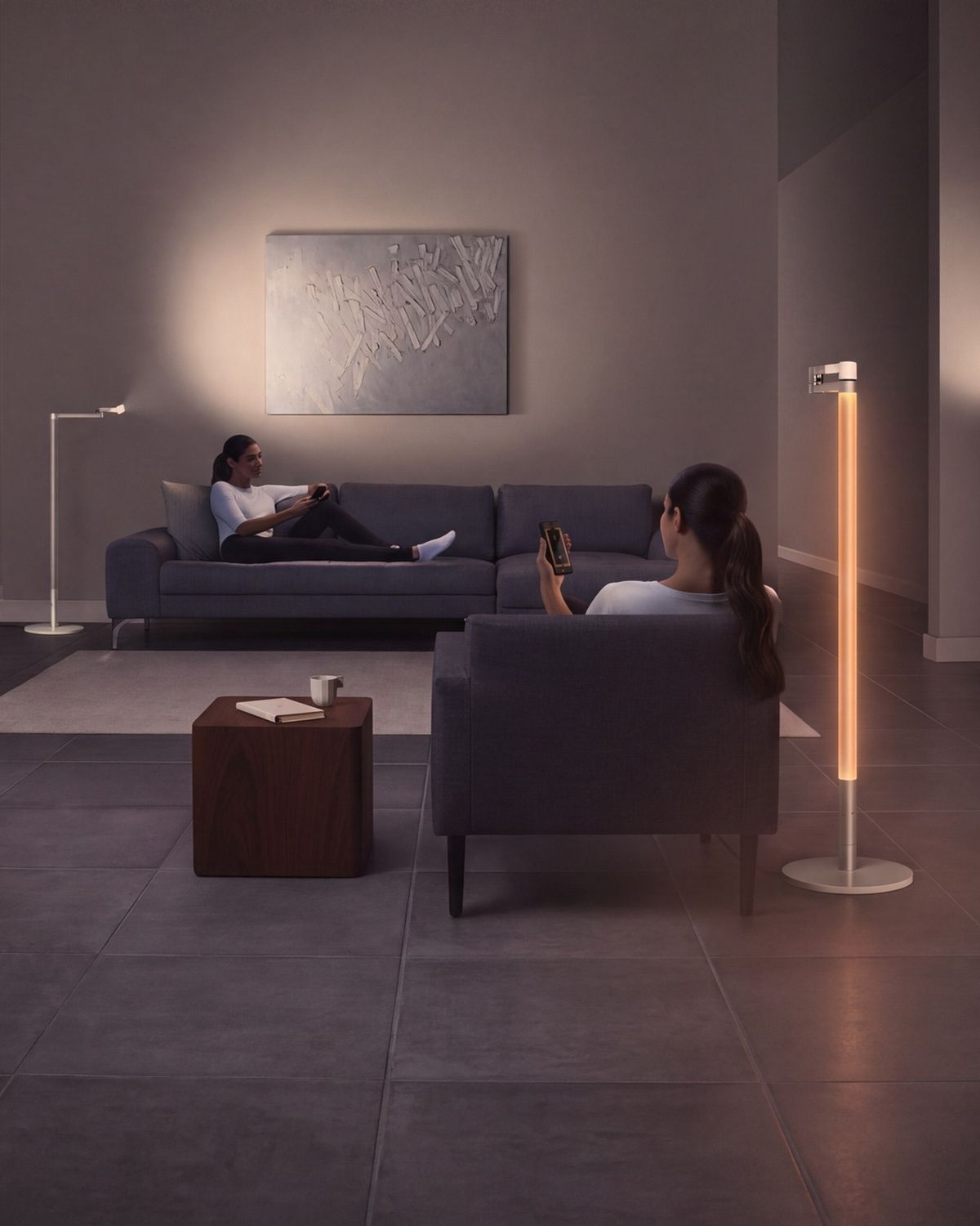 One room, with the Dyson Lightcycle Morph light in different positions to cast different types of light depending on how it's transformed. 