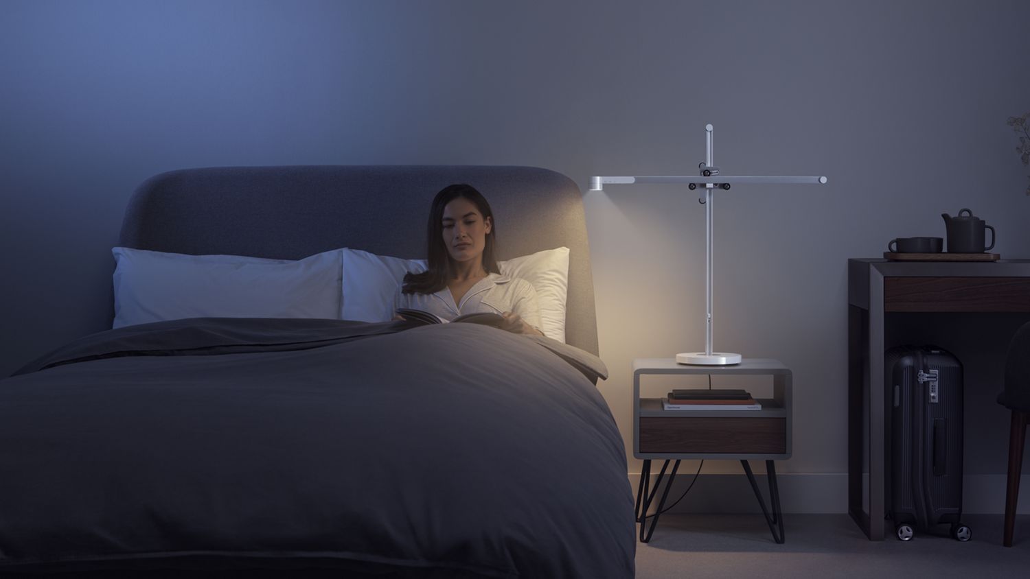 A Dyson Lightcycle task light on a bedside table.