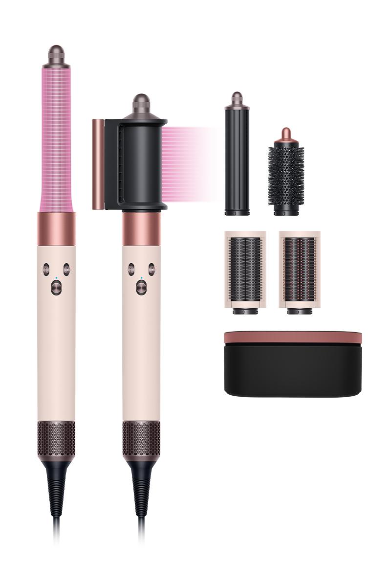 Full-length view of the Dyson Airwrap multi-styler and dryer finished in Ceramic pink and rose gold. Full-length view of the Dyson Airwrap multi-styler and dryer finished in Ceramic pink and rose gold.
